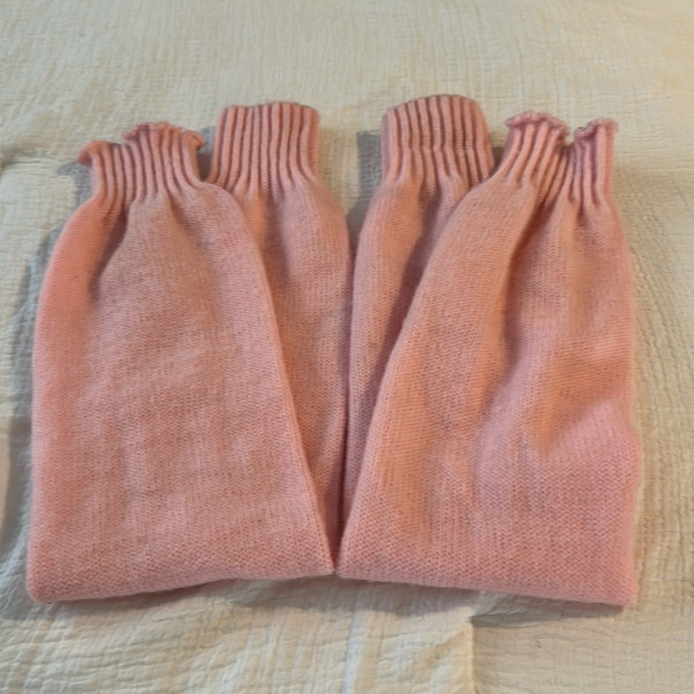 Pink legwarmers 27 inches long.